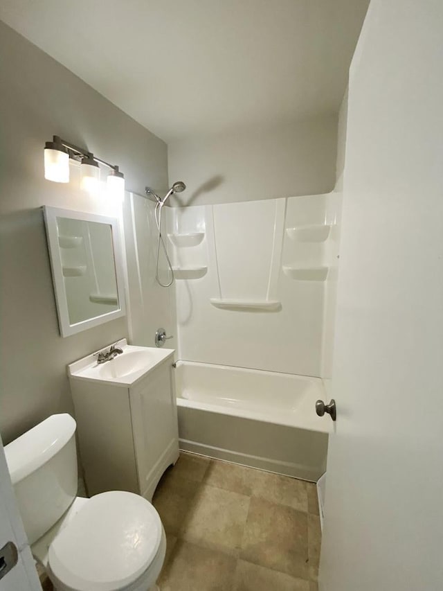 full bathroom with washtub / shower combination, vanity, and toilet