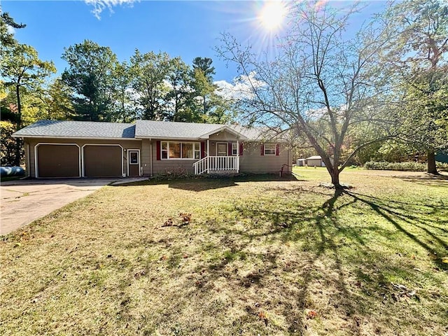 single story home featuring a front lawn and a garage