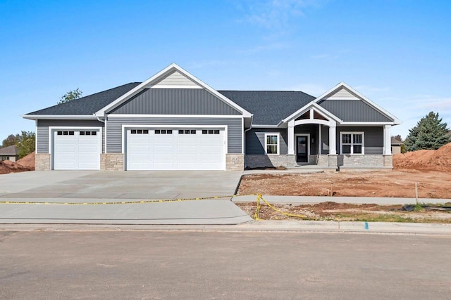 craftsman inspired home with a garage