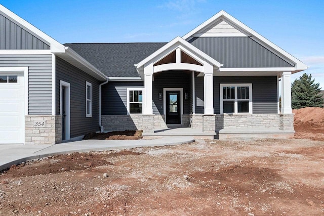 craftsman house featuring a garage and covered porch