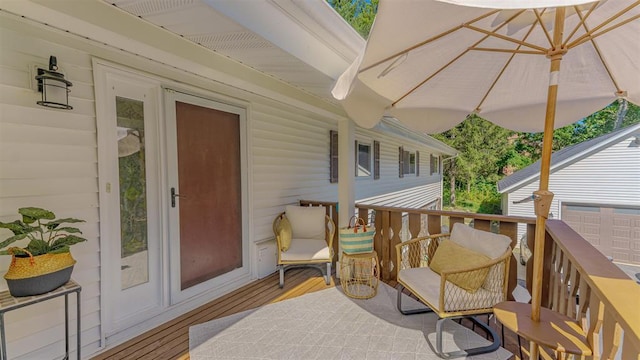 wooden deck featuring a garage