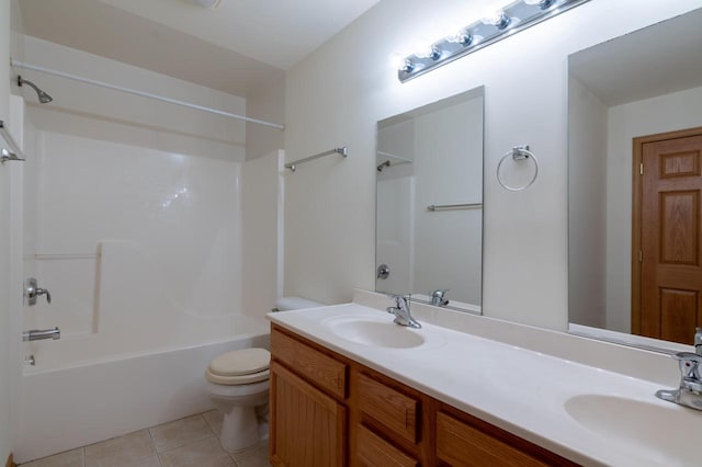 full bathroom with tile patterned flooring, vanity, shower / tub combination, and toilet