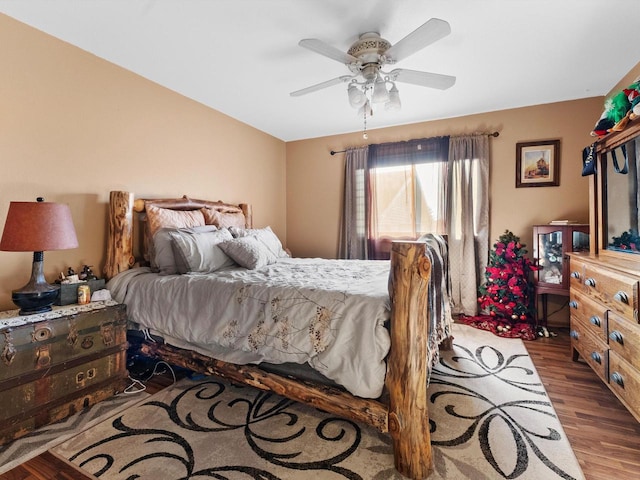 bedroom featuring dark hardwood / wood-style floors and ceiling fan