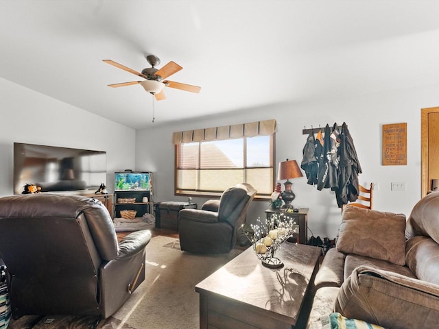 carpeted living room with vaulted ceiling and ceiling fan