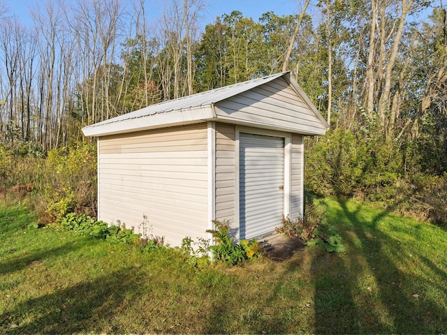 garage featuring a yard