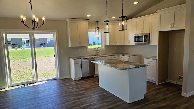 kitchen featuring appliances with stainless steel finishes, a healthy amount of sunlight, and white cabinetry