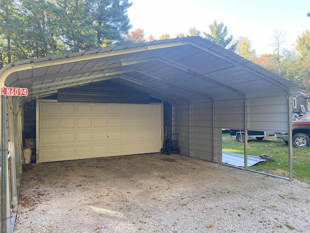 exterior space featuring a carport and a garage