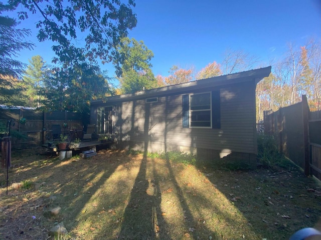 view of property exterior with a yard