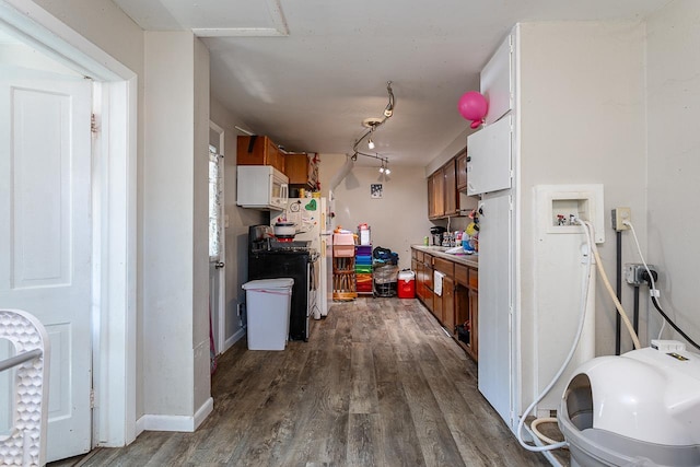 kitchen with dark hardwood / wood-style flooring