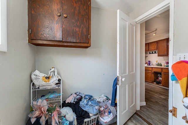 laundry area with hardwood / wood-style flooring