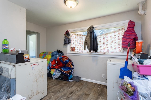 laundry room featuring wood-type flooring and washing machine and clothes dryer