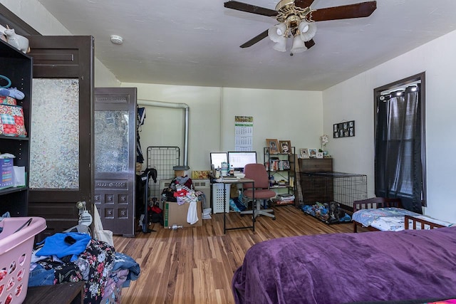 bedroom featuring ceiling fan and hardwood / wood-style flooring