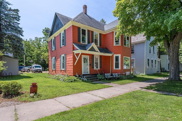 view of front of property with a front lawn