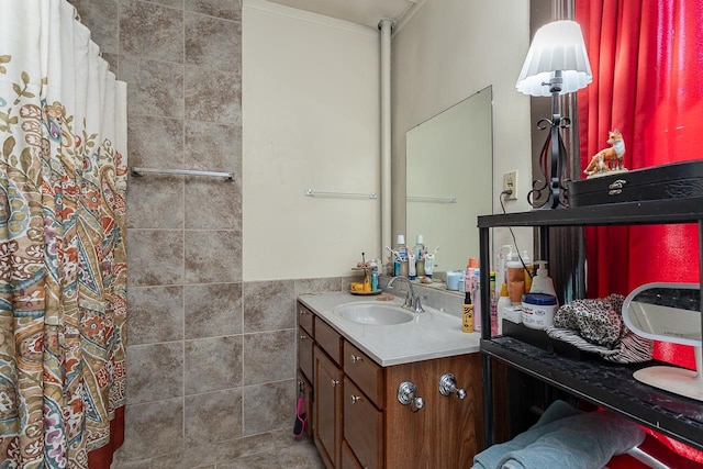 bathroom with tile walls and vanity