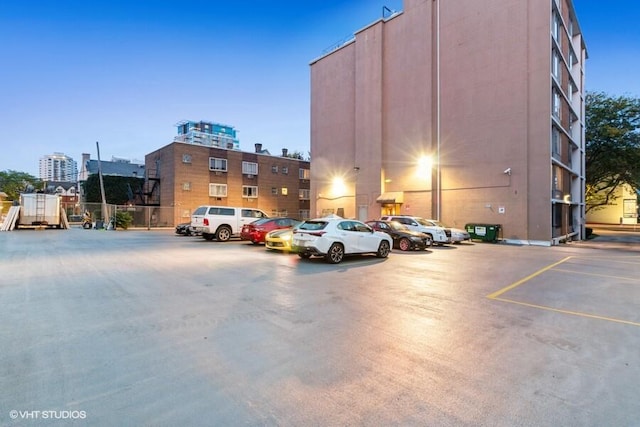 view of parking at dusk