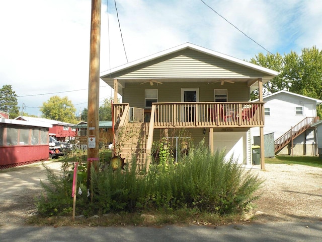 view of front of property with a garage and a porch