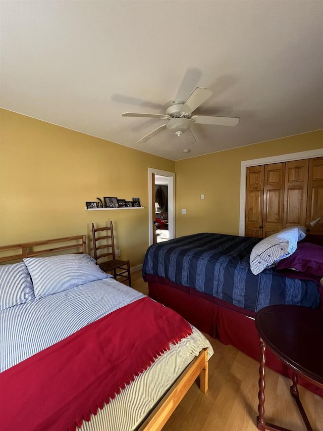 bedroom featuring a closet, ceiling fan, and hardwood / wood-style flooring