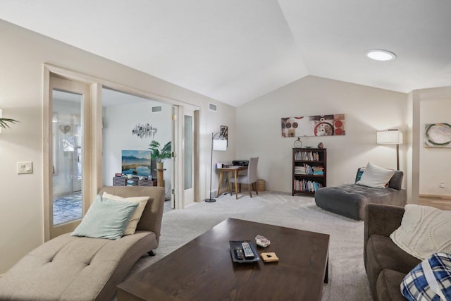 carpeted living room with vaulted ceiling