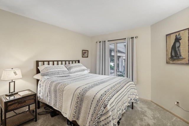 bedroom featuring access to outside and carpet