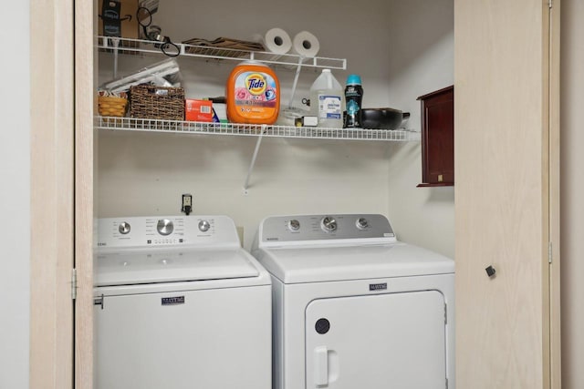 clothes washing area with independent washer and dryer