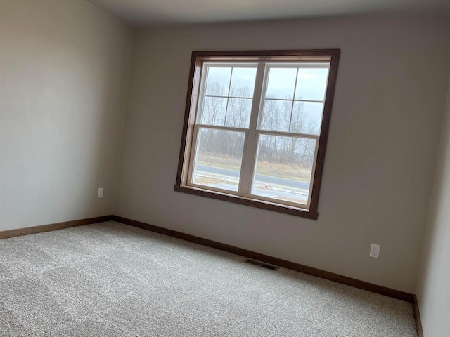 spare room with carpet flooring