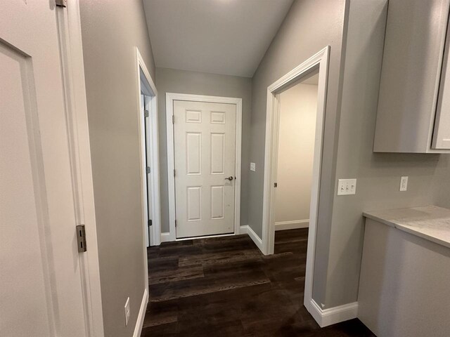 corridor featuring dark hardwood / wood-style flooring