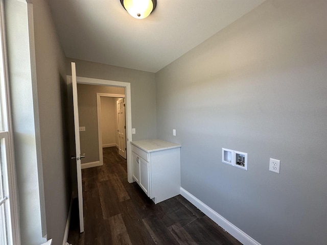 laundry area with cabinets, washer hookup, and dark hardwood / wood-style flooring