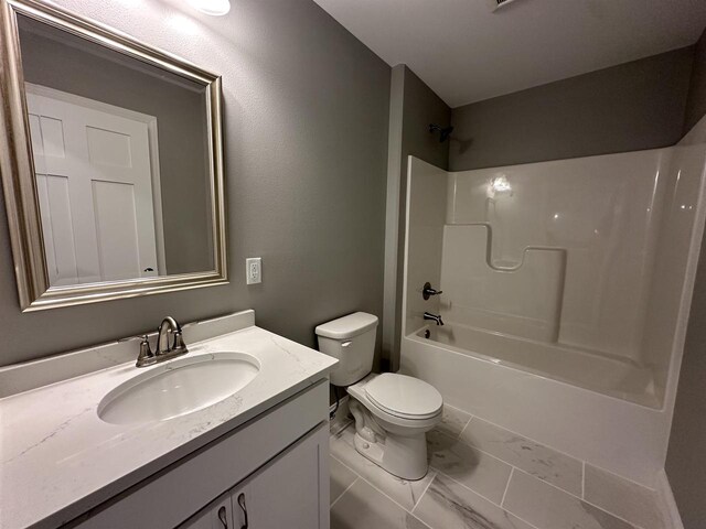 full bathroom featuring shower / washtub combination, vanity, and toilet