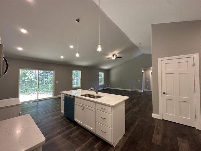 kitchen featuring lofted ceiling, sink, black dishwasher, an island with sink, and white cabinetry