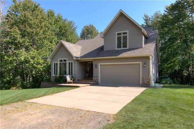 view of front of home with a front yard and a garage