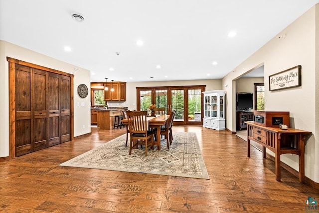 dining area featuring hardwood / wood-style floors and french doors