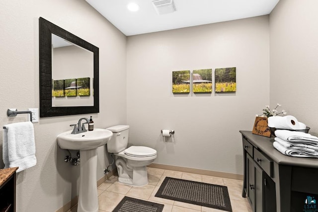 bathroom with tile patterned floors and toilet