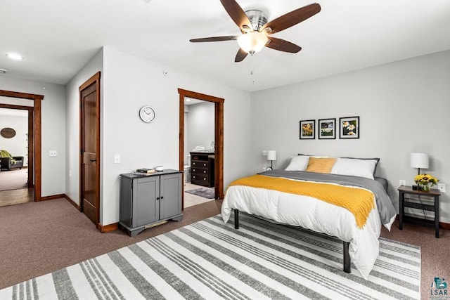 bedroom with dark colored carpet and ceiling fan