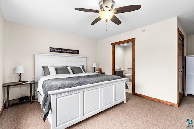 carpeted bedroom with ceiling fan and ensuite bathroom