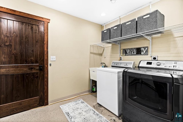 laundry room with washing machine and dryer and sink