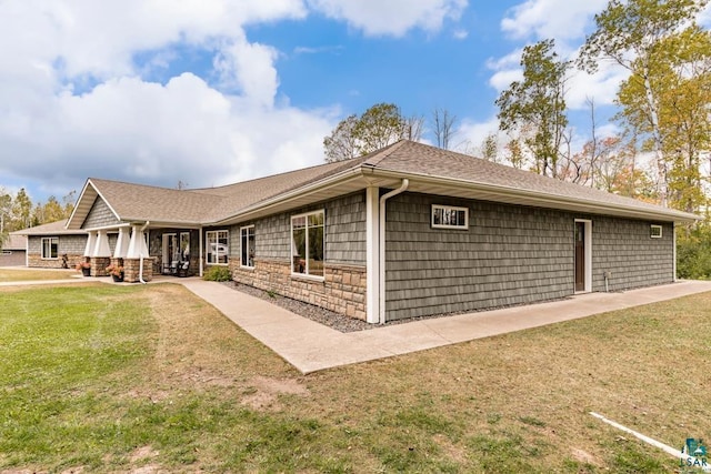 view of property exterior with a lawn