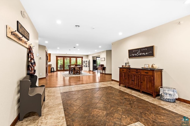 interior space with hardwood / wood-style flooring and french doors