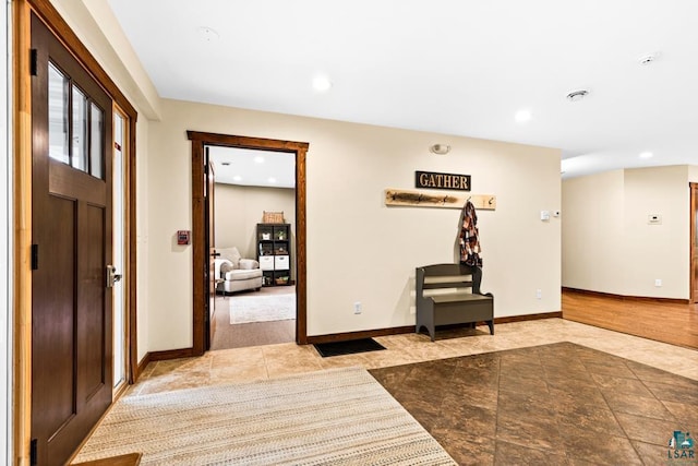 hallway with light hardwood / wood-style flooring