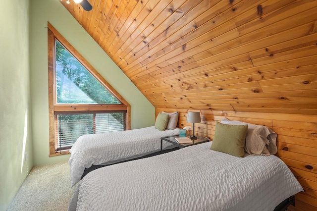 carpeted bedroom with wood ceiling, wood walls, ceiling fan, and high vaulted ceiling