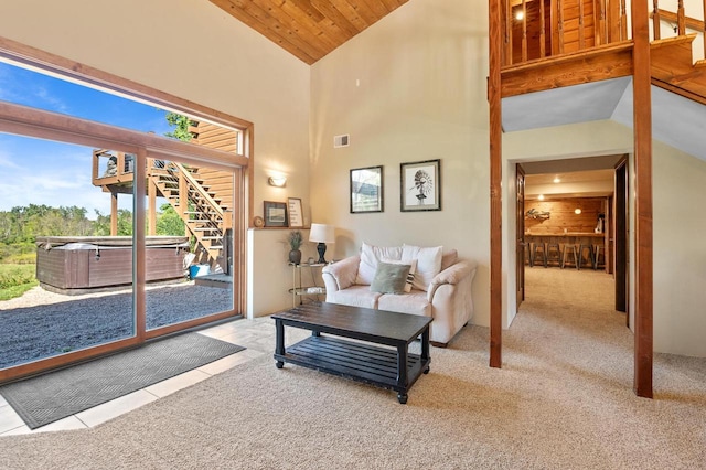 living room featuring high vaulted ceiling, light colored carpet, and wooden ceiling