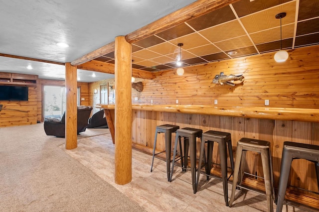 bar with carpet floors and wooden walls