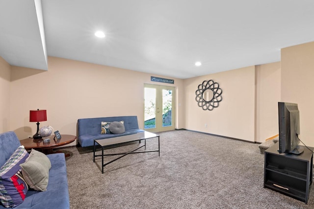 living room featuring french doors and carpet