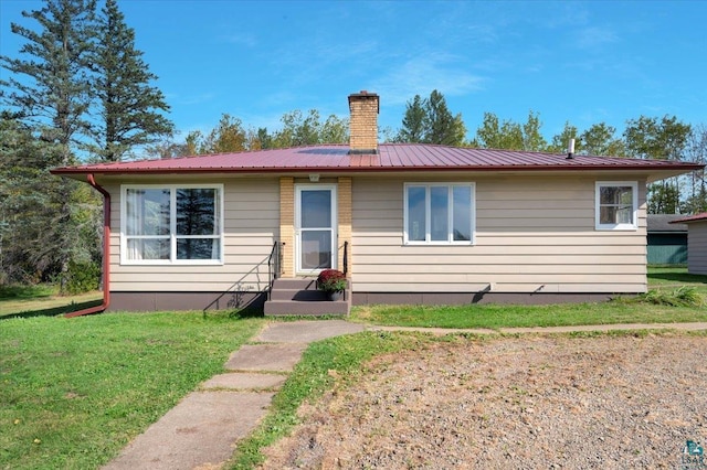 view of front of home with a front lawn