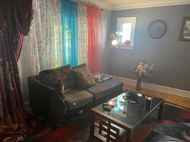 living room featuring wood-type flooring and ornamental molding