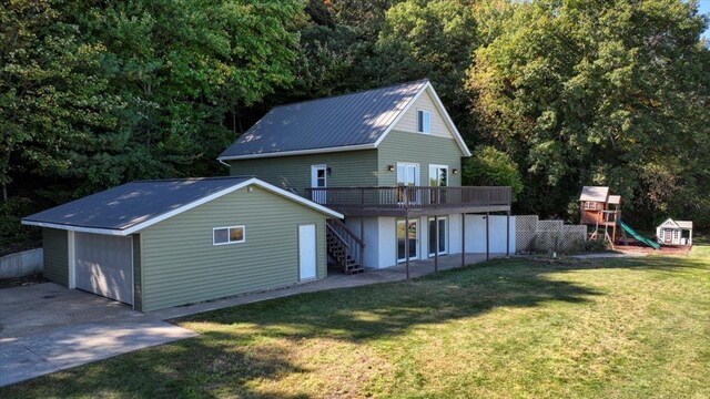 W9037 Ridgeview Trl, New Lisbon, WI 53950 - rear view of property featuring stairs, a playground, metal roof, a deck, and a yard