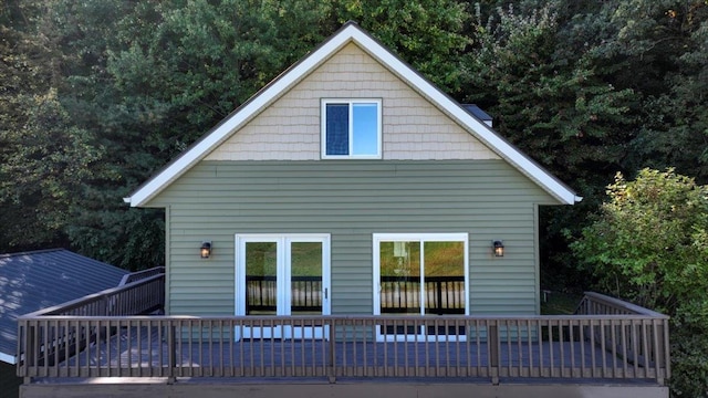 back of property with a wooden deck