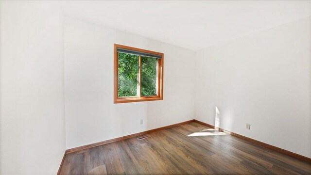 W9037 Ridgeview Trl, New Lisbon, WI 53950 - spare room featuring wood finished floors and baseboards