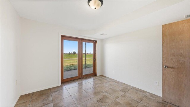 W9037 Ridgeview Trl, New Lisbon, WI 53950 - empty room featuring baseboards and french doors
