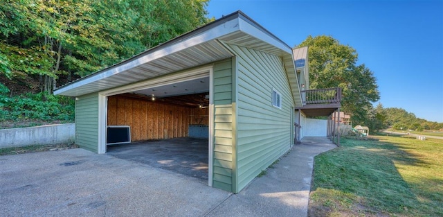 view of outdoor structure with a yard and a carport