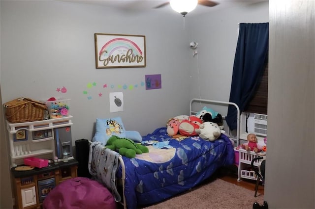 bedroom with carpet floors, cooling unit, and ceiling fan